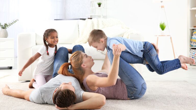 family playing on the floor